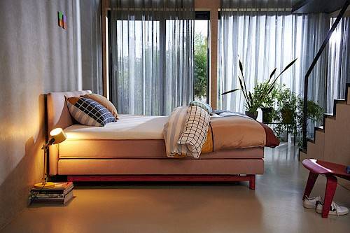 Cozy bedroom with a made-up Auping boxspring